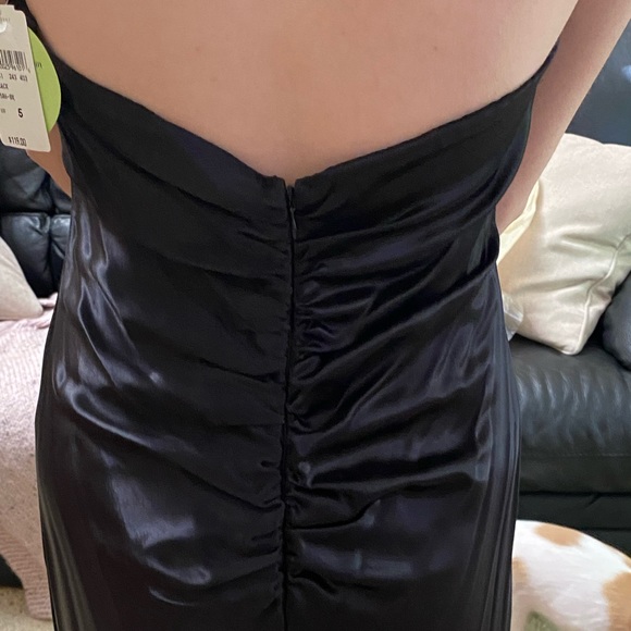 Long black prom dress back has sheer black triangle from legs down to floor - Picture 2 of 4